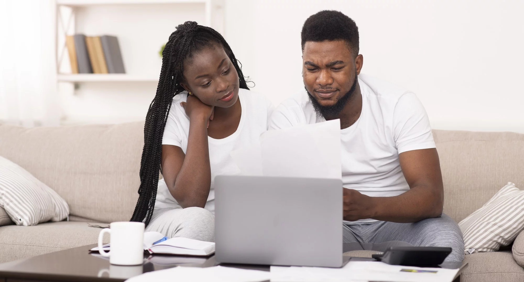 young couple shopping for home insurance online