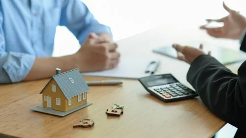 Insurance agent introducing property insurance policies to homeowners.